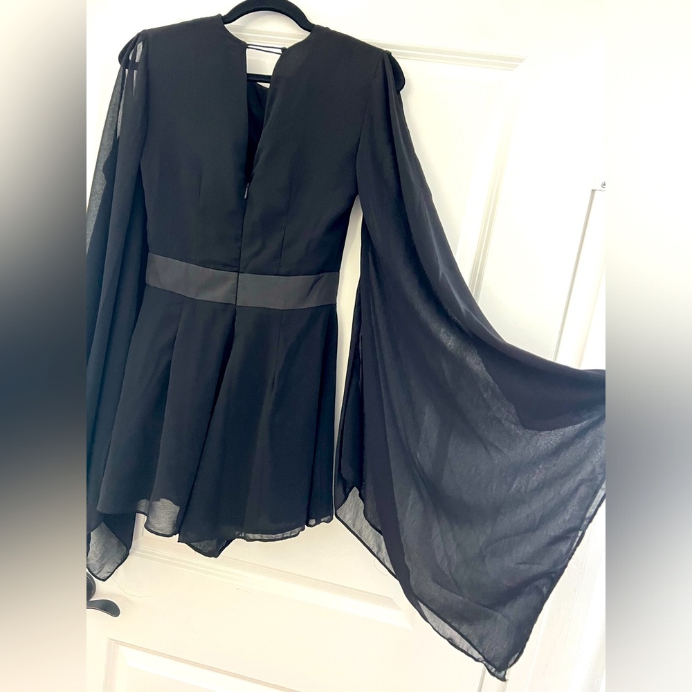 Size small black romper with sheer sleeves and cutout detailing